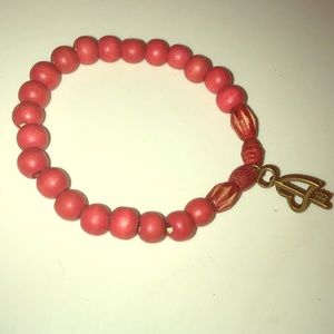 Red wood bead bracelet with brass heart